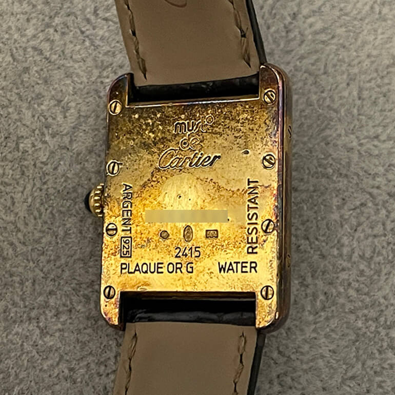 カルティエタンクの変色取り修理、お預かり時の裏面