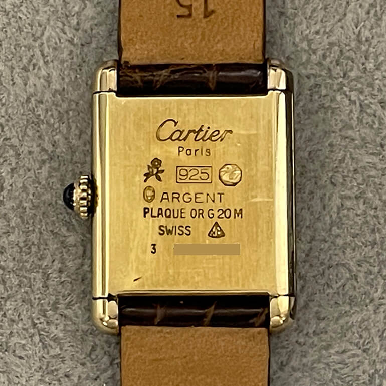 カルティエタンク再メッキ修理前の裏面の写真