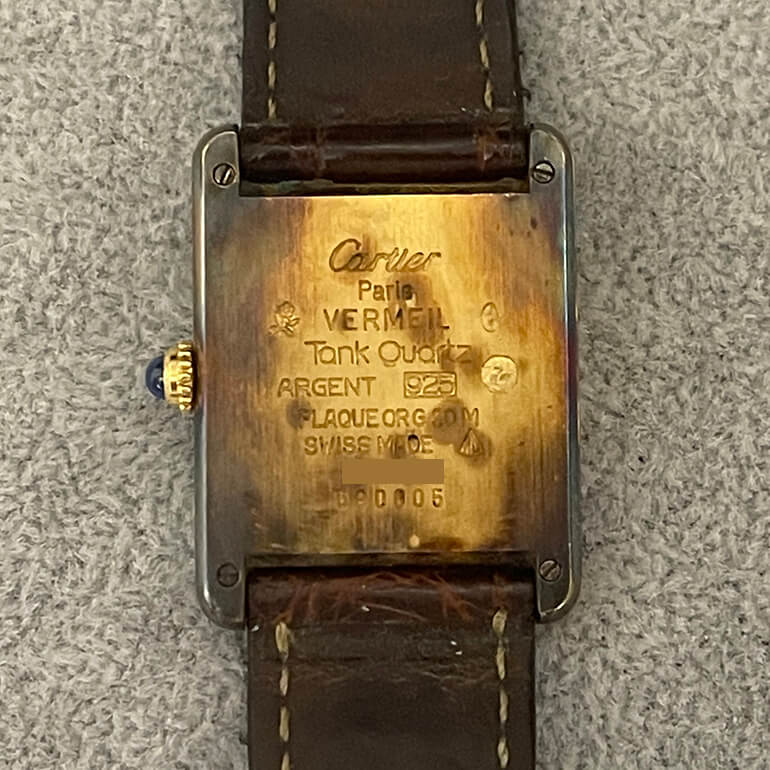 カルティエマストタンクの変色取り修理前の裏面