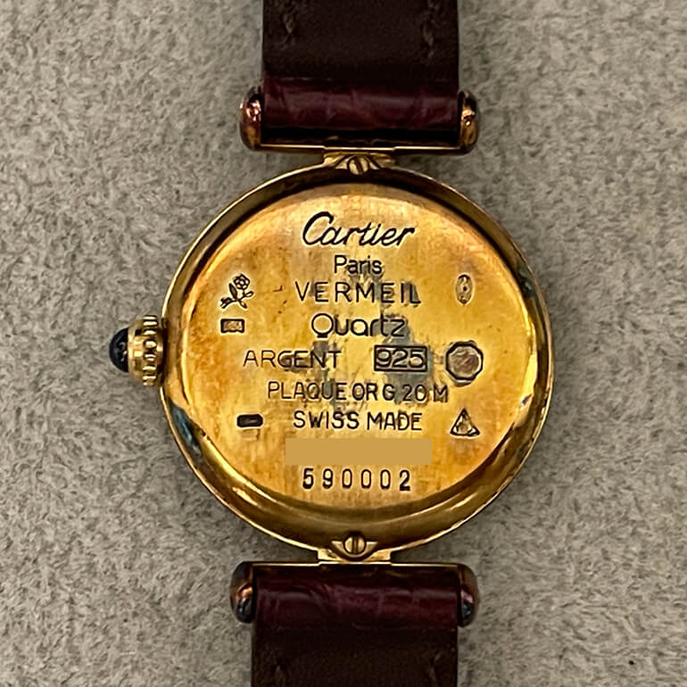 変色取り前のカルティエマストコリゼの裏面