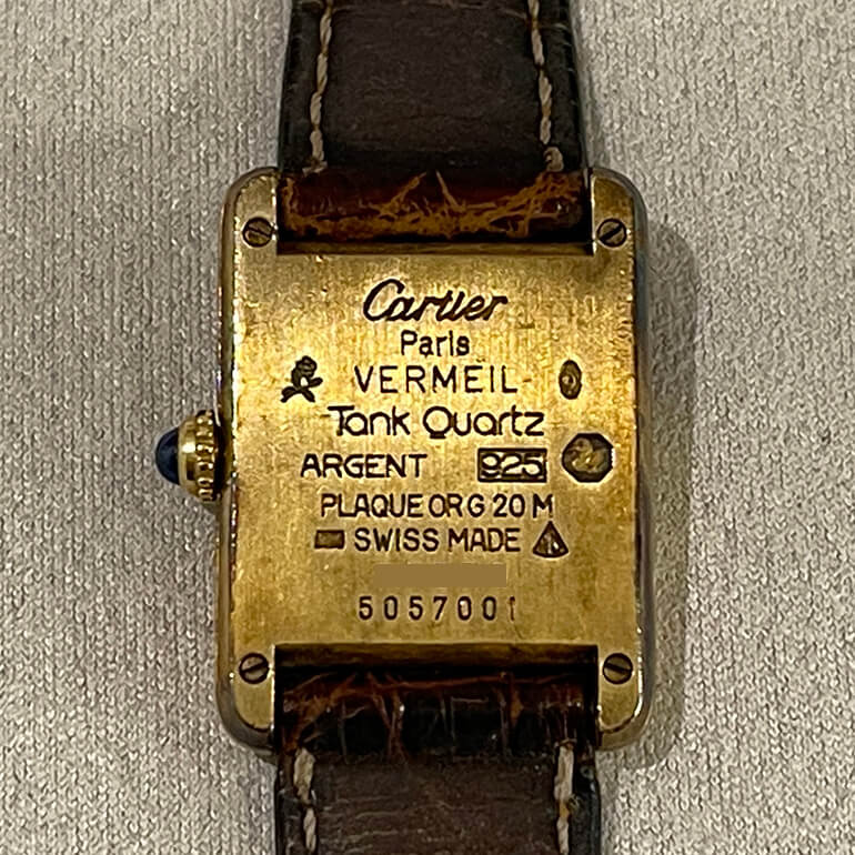 変色取り修理前のカルティエマストタンクの裏面