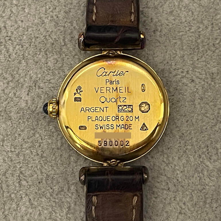 変色取り修理前のカルティエマストコリゼの裏面