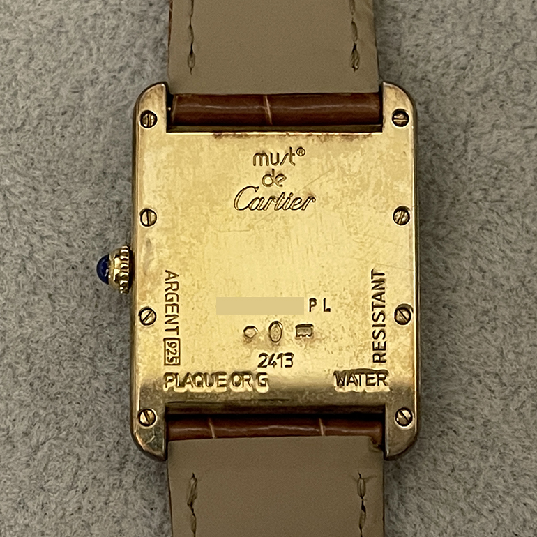 カルティエタンク再メッキ修理前の裏面の写真